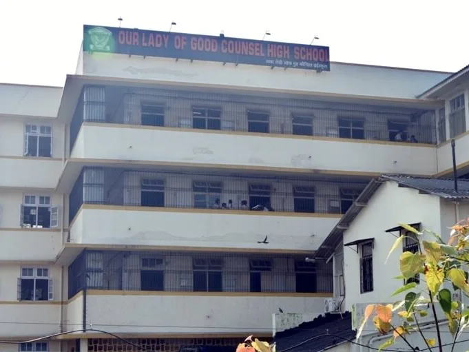 Students at the school building entrance